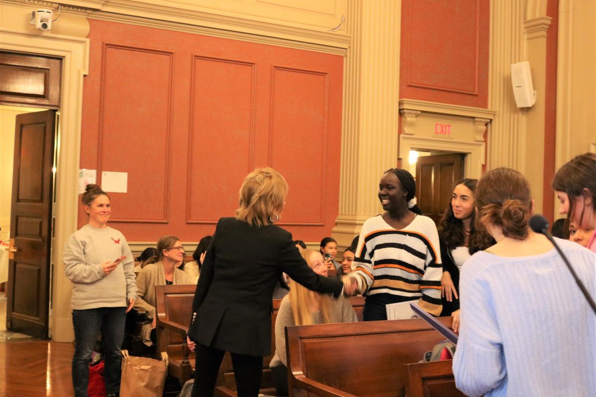 Valerie Biden Owens shakes hands with a student