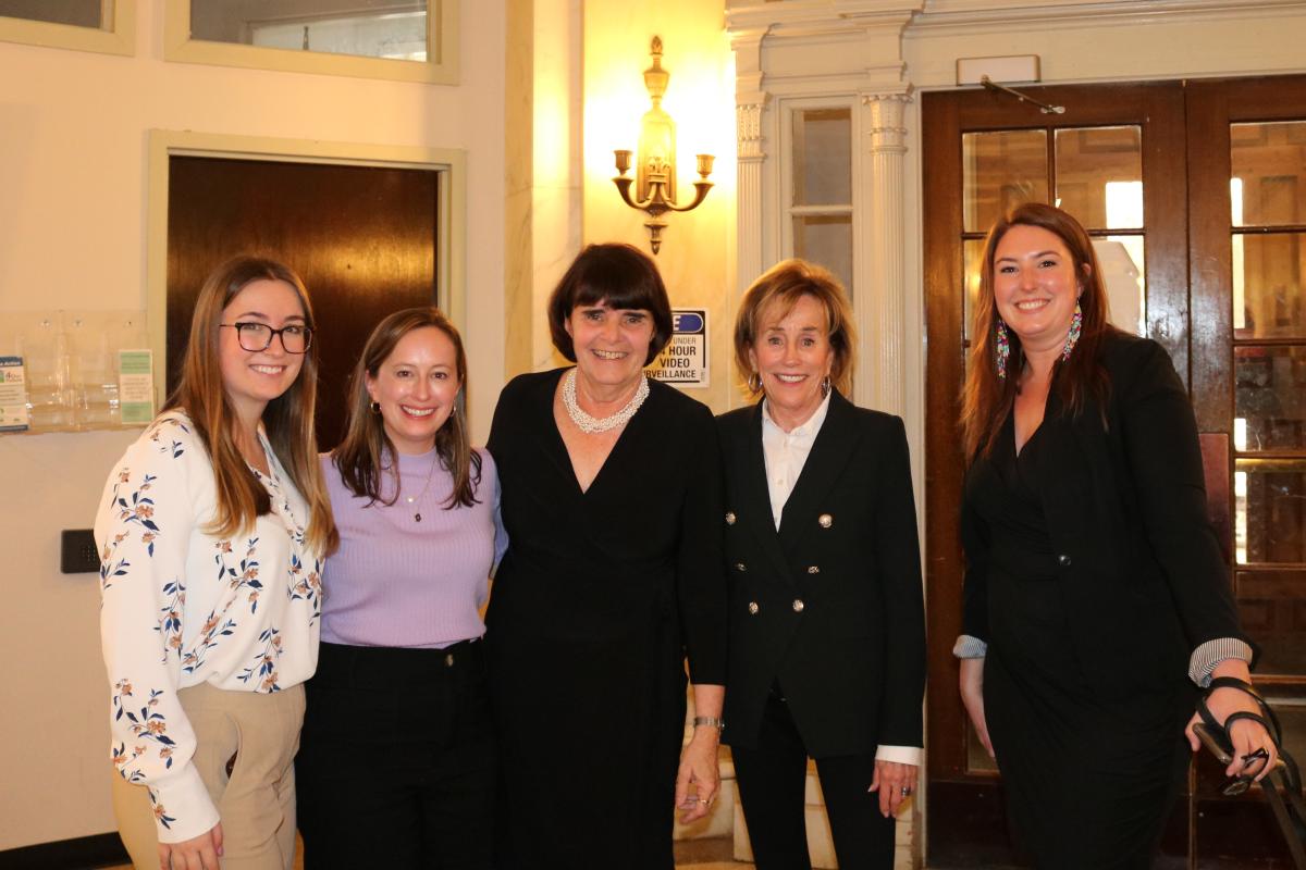 Middlesex District Attorney's Office employees, District Attorney Marian Ryan, and Valerie Biden Owens pose for a photo