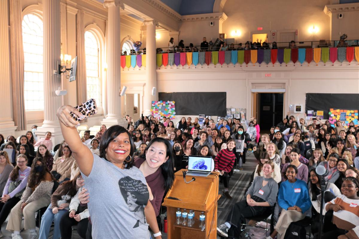 Speakers Diana Hwang and Lisa Fortenberry take a selfie with students