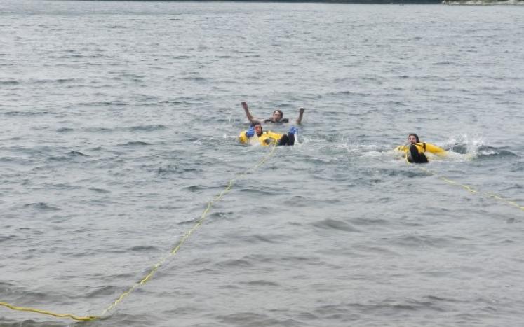 The Stoneham Fire Department Dive Team demonstrates a simulated drowning and rescue operation.