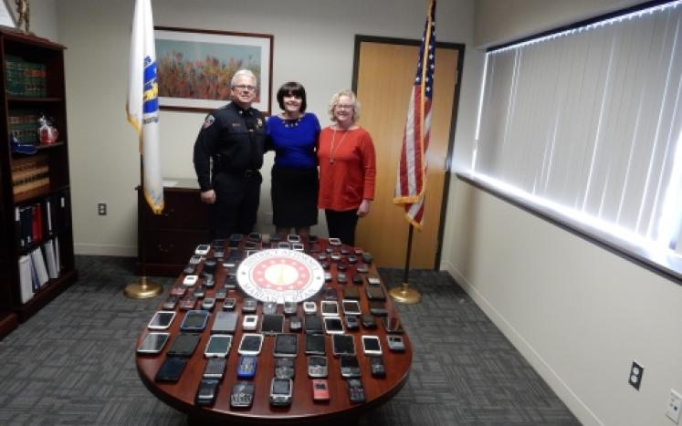 DA Ryan Donates Over 100 Cell Phones to Benefit Voices Against Violence